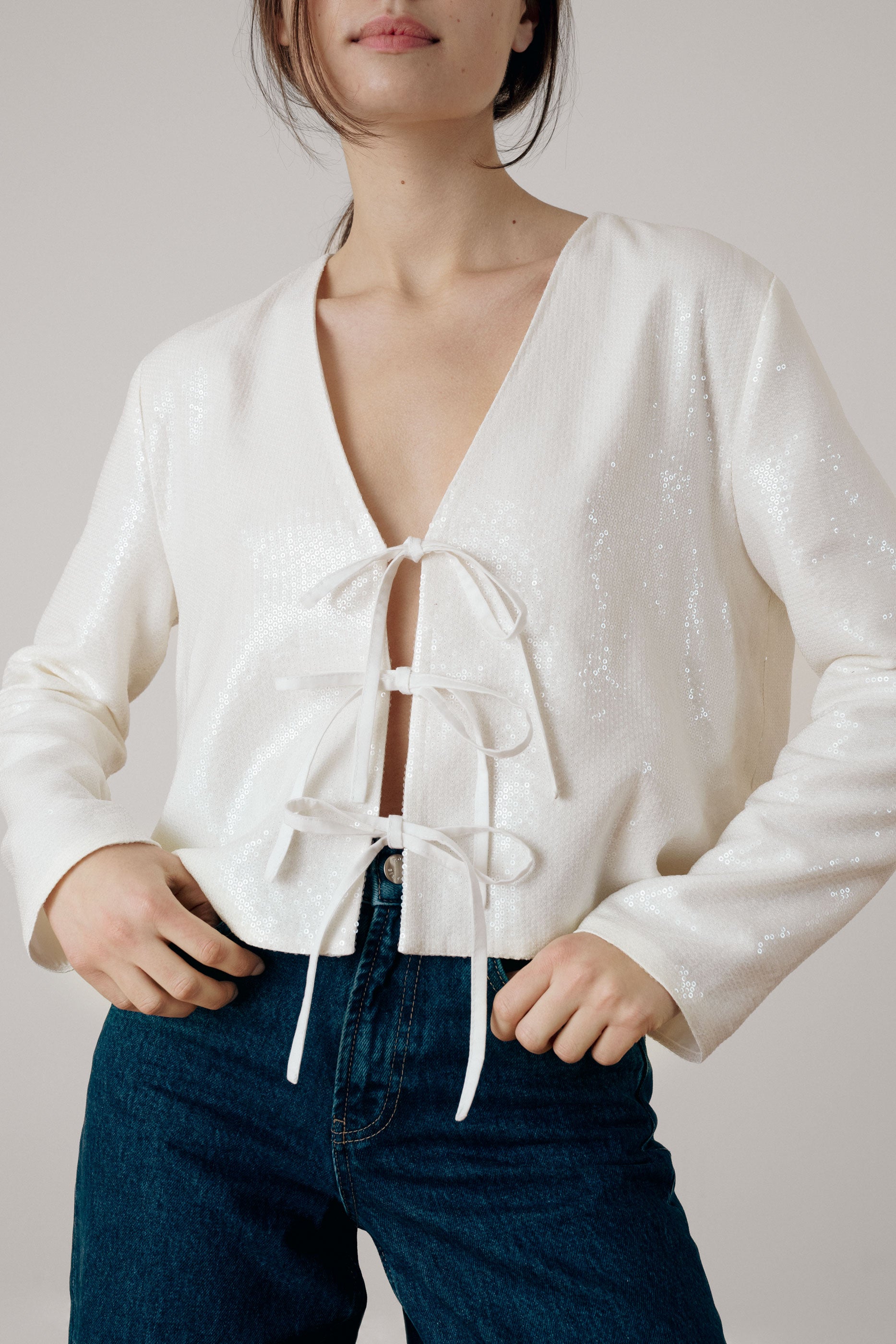Ivory sequin knot blouse