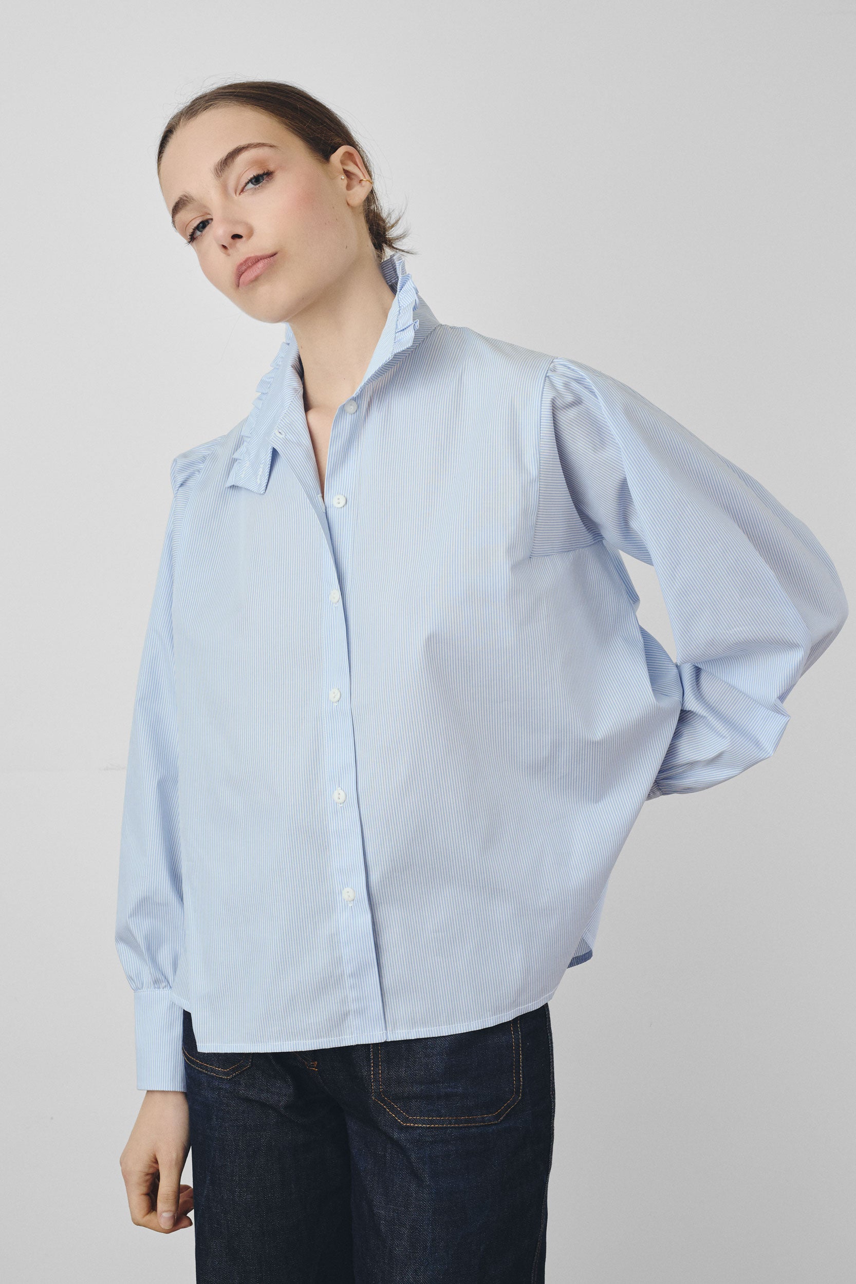 Blue striped shirt with stand-up collar and ruffles